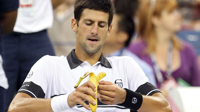 Novak Djokovic eating a banana