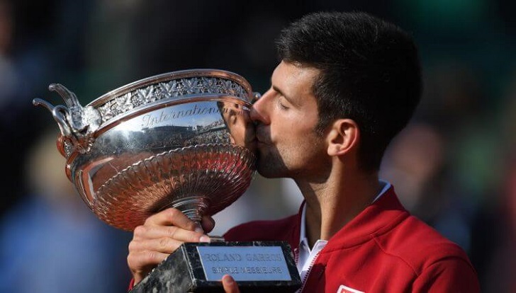 Novak Djokovic with the French Open trophy.